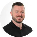 Adam-Vickers: "Professional headshot of Adam Vickers, a man with a beard in a black shirt."