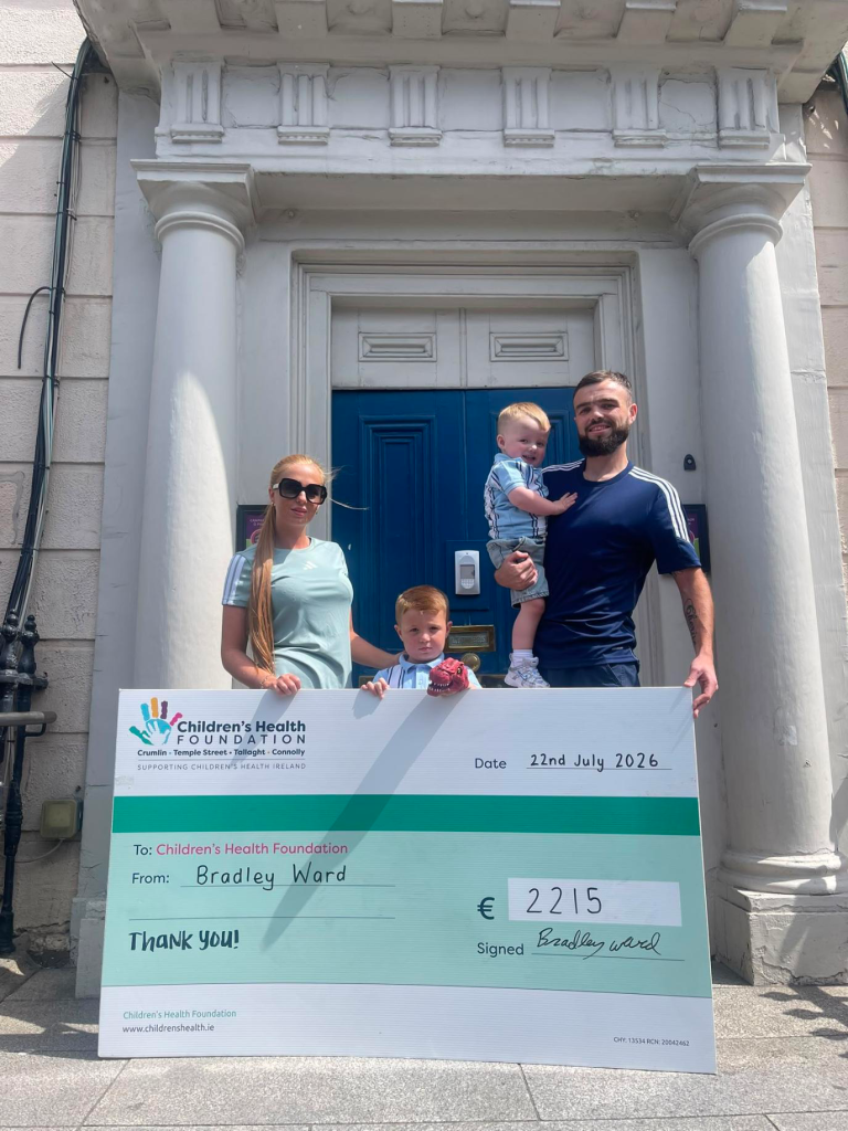 Bradley with his family presenting a cheque after his 70km fundraising cycle for Children’s Health Foundation.