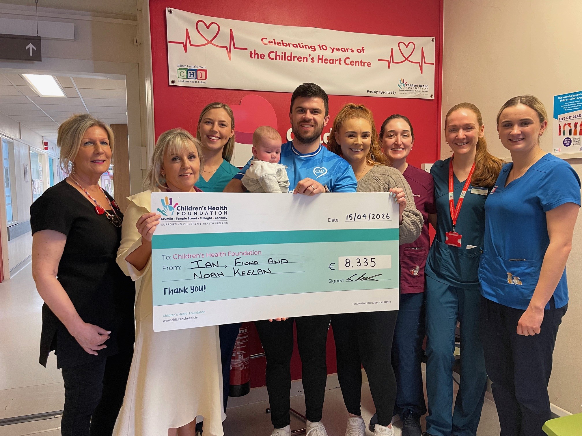 Ian, Noah and family presenting a cheque for €8,335 to staff at the Children’s Heart Centre at CHI Crumlin.